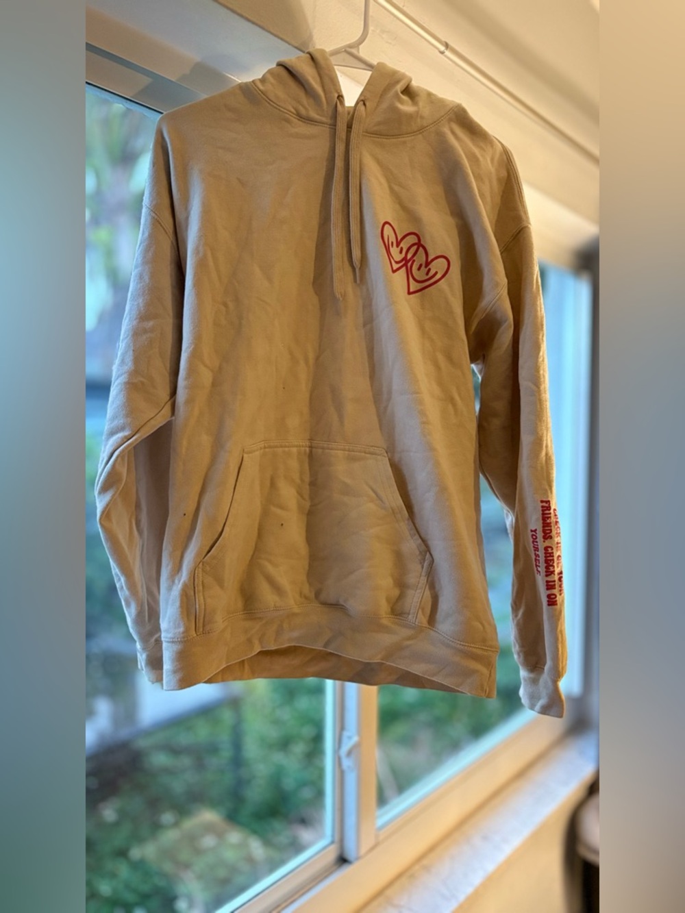 Let’s Look After Each Other” Hoodie – Beige w/ Red Smiley Heart Graphic